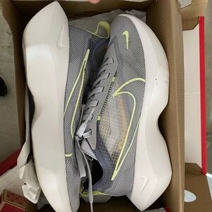 Nike Gray and White Running Shoes with Yellow Accents